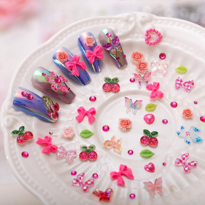 28 Grids Nail Charms Kit with Rhinestones for Nails - 3D Kawaii Bows, Cherry, Flowers, Butterfly, Red Pink Gold Nail Gems, Pearls & Metal Studs - DIY Manicure Art Supplies with Wax Pen & Tweezers