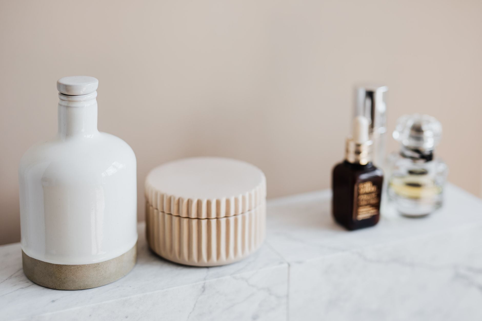 Everyday skincare routine on a bathroom shelf
